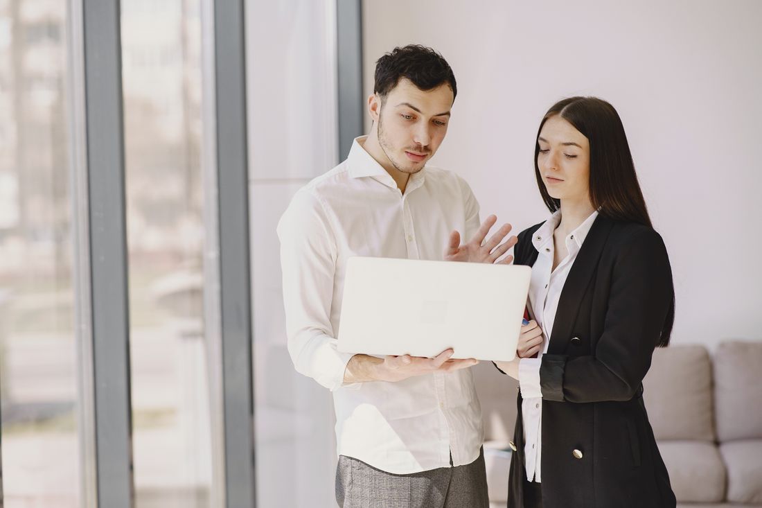 Colleagues discussing a piece of work together
